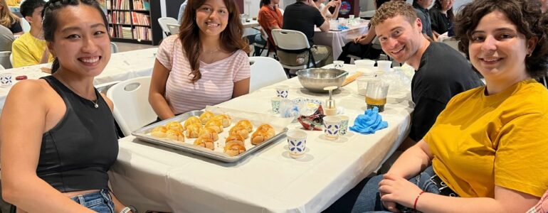 TCML students with handmade egg yolk pastries during a Mid-Autumn Festival cultural activity