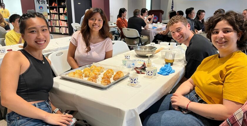 TCML students with handmade egg yolk pastries during a Mid-Autumn Festival cultural activity